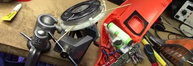 Vacuum cleaner repair parts and tools on a workbench in Orlando, FL